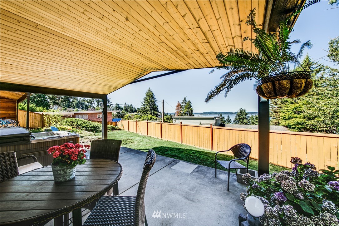4401 Sunset Beach Road West University Place, WA 98466 - Photo 9 of 40 a view of a patio with swimming pool
