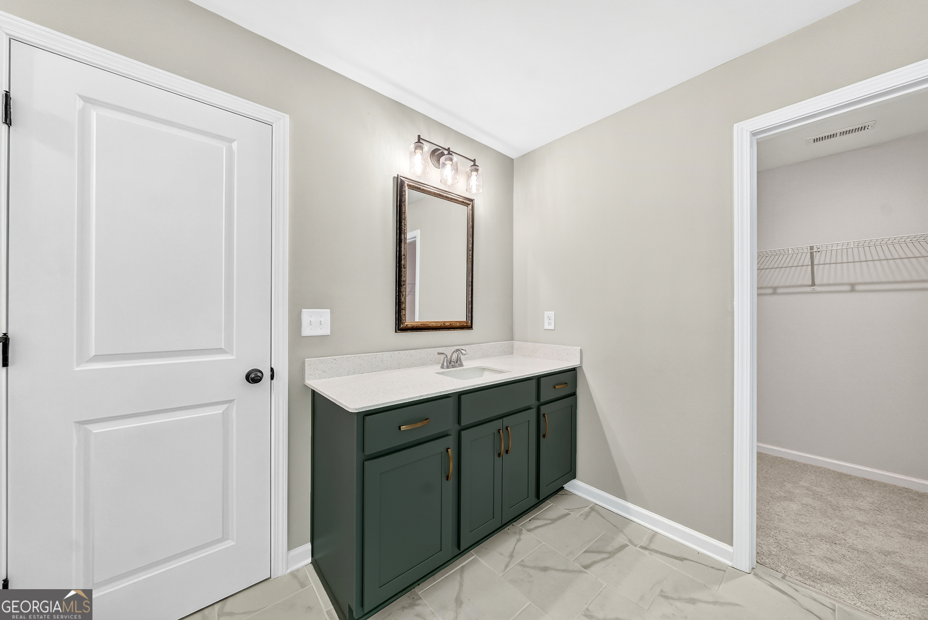 38 Oak Ridge Drive, Unit 26 Waverly Hall, GA 31831 - Photo 23 of 37 a bathroom with a sink and a mirror