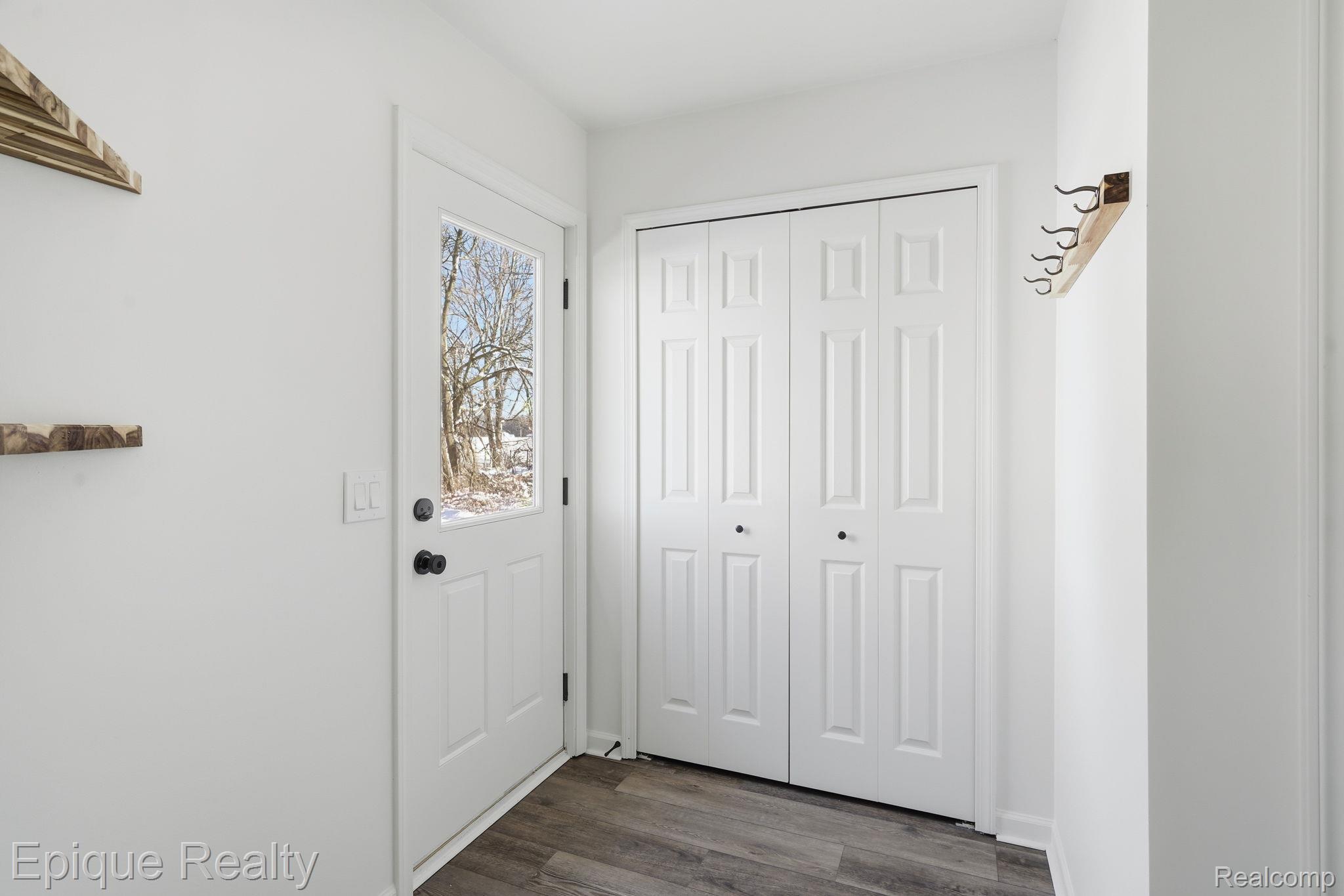 8680 Oakhill Road Clarkston, MI 48348 - Photo 24 of 52 Doorway with wood finished floors