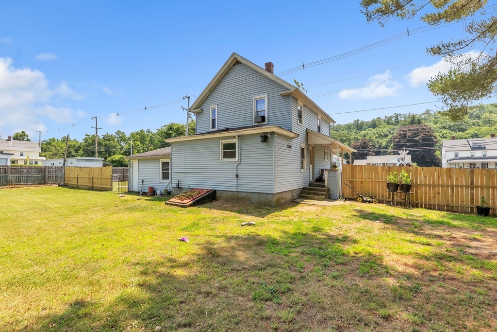 45 Ford Street, Unit A B Three Rivers, MA 01080 - Photo 11 of 42 a view of a house with a yard