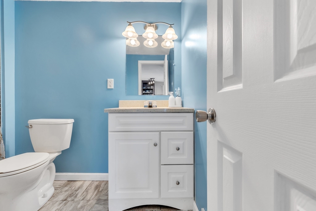 45 Ford Street, Unit A B Three Rivers, MA 01080 - Photo 16 of 42 a bathroom with a sink a toilet and a mirror