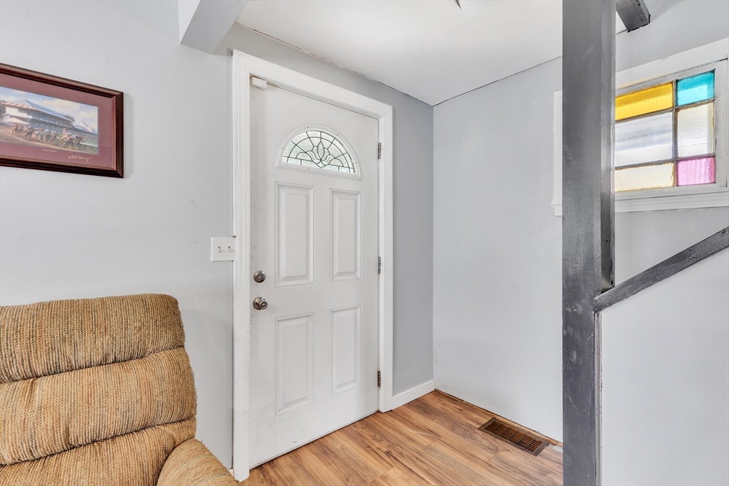 45 Ford Street, Unit A B Three Rivers, MA 01080 - Photo 32 of 42 a view of a bedroom with wooden floor and cabinet
