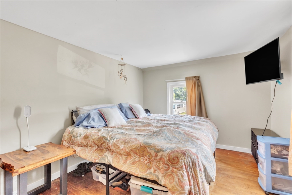 45 Ford Street, Unit A B Three Rivers, MA 01080 - Photo 36 of 42 a bedroom with a bed and a flat screen tv