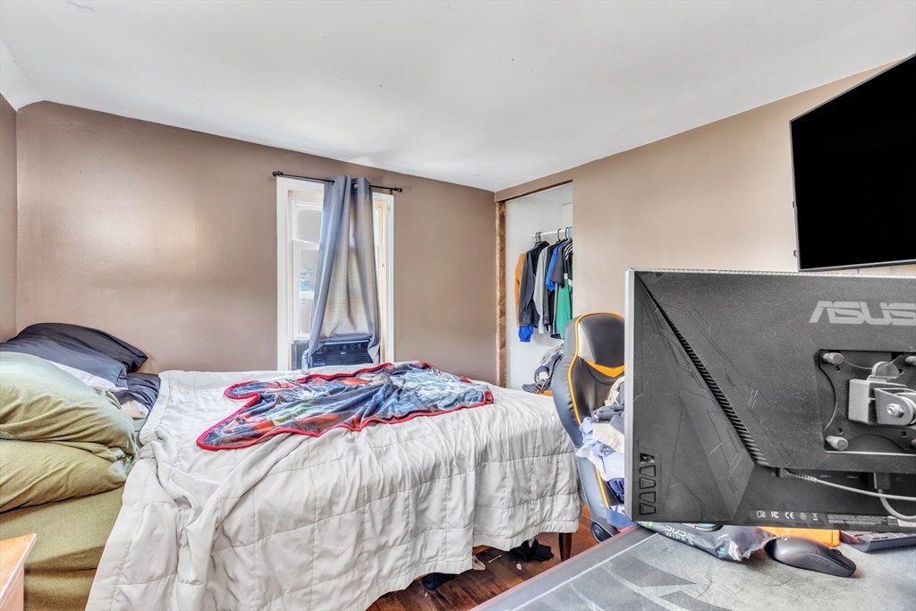 45 Ford Street, Unit A B Three Rivers, MA 01080 - Photo 40 of 42 a bedroom with a bed and a flat screen tv