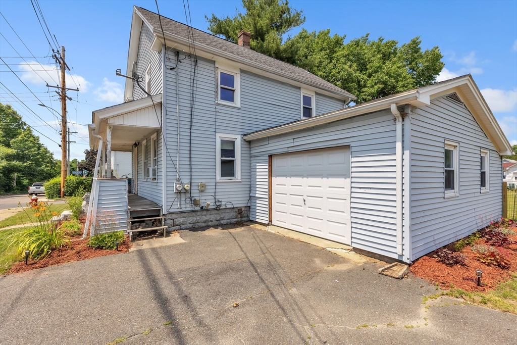 45 Ford Street, Unit A B Three Rivers, MA 01080 - Photo 5 of 42 a front view of a house with a garage