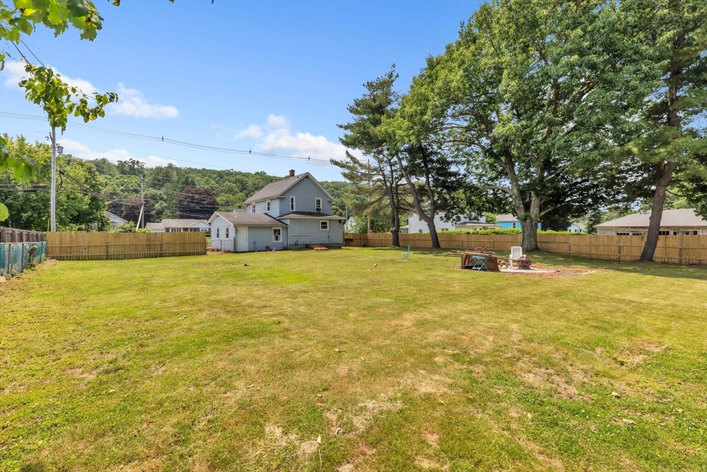 45 Ford Street, Unit A B Three Rivers, MA 01080 - Photo 7 of 42 a view of swimming pool with lawn chairs and large tree