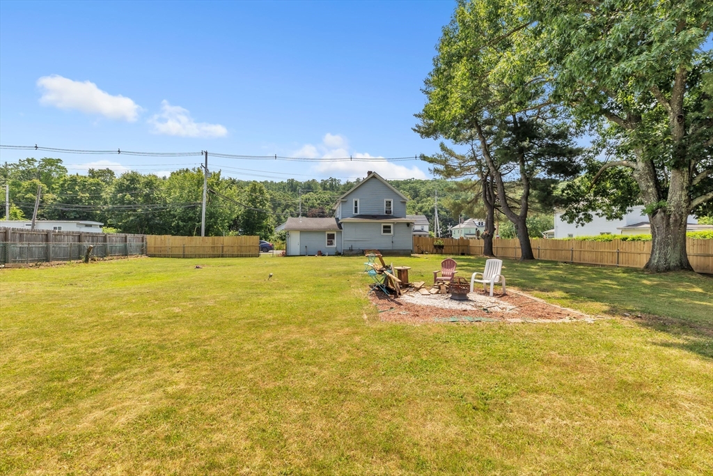 45 Ford Street, Unit A B Three Rivers, MA 01080 - Photo 8 of 42 a view of a swimming pool with an outdoor seating and a garden