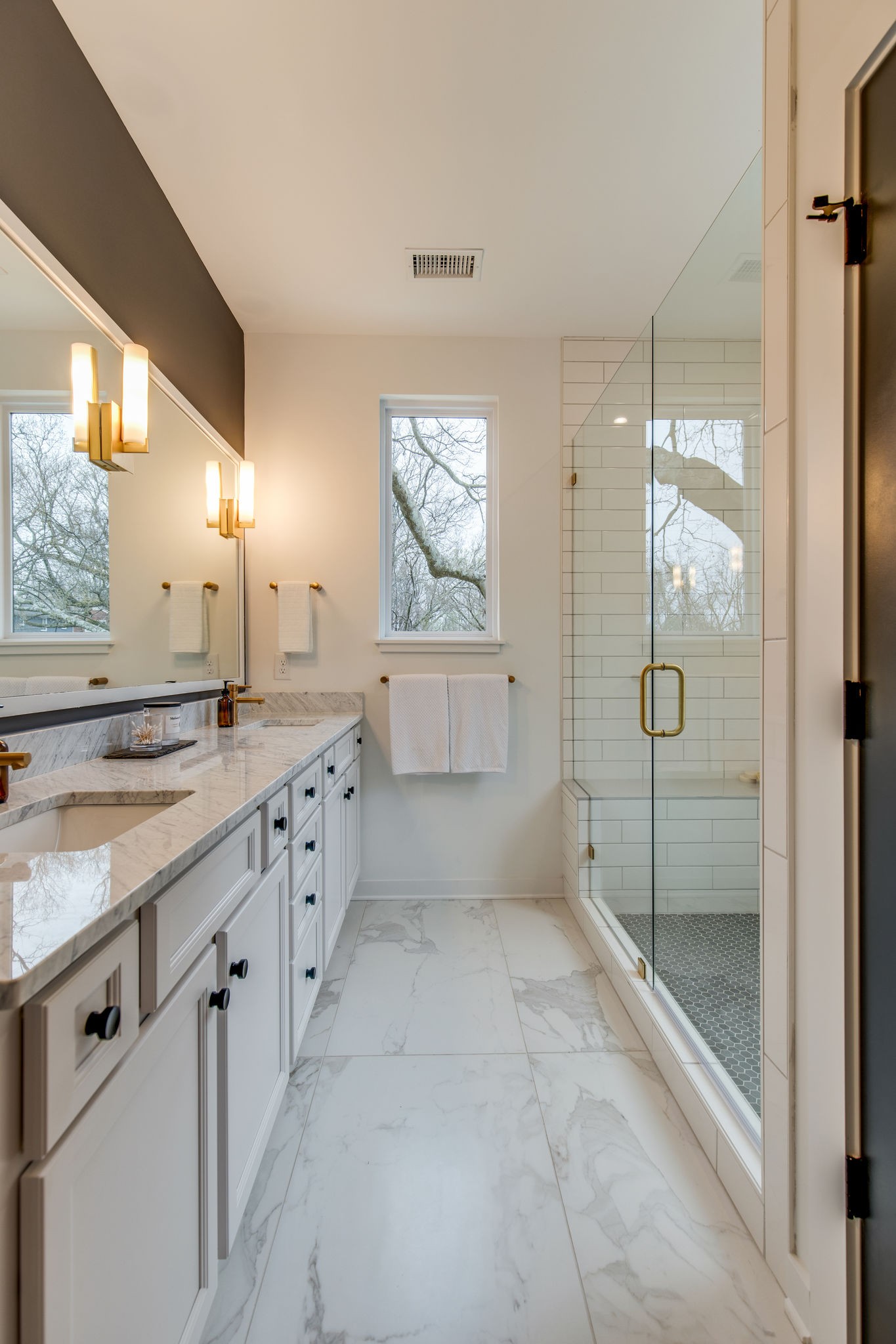 1005 B Mitchell Road Nashville, TN 37206 - Photo 11 of 25 a large bathroom with a glass shower door and a sink