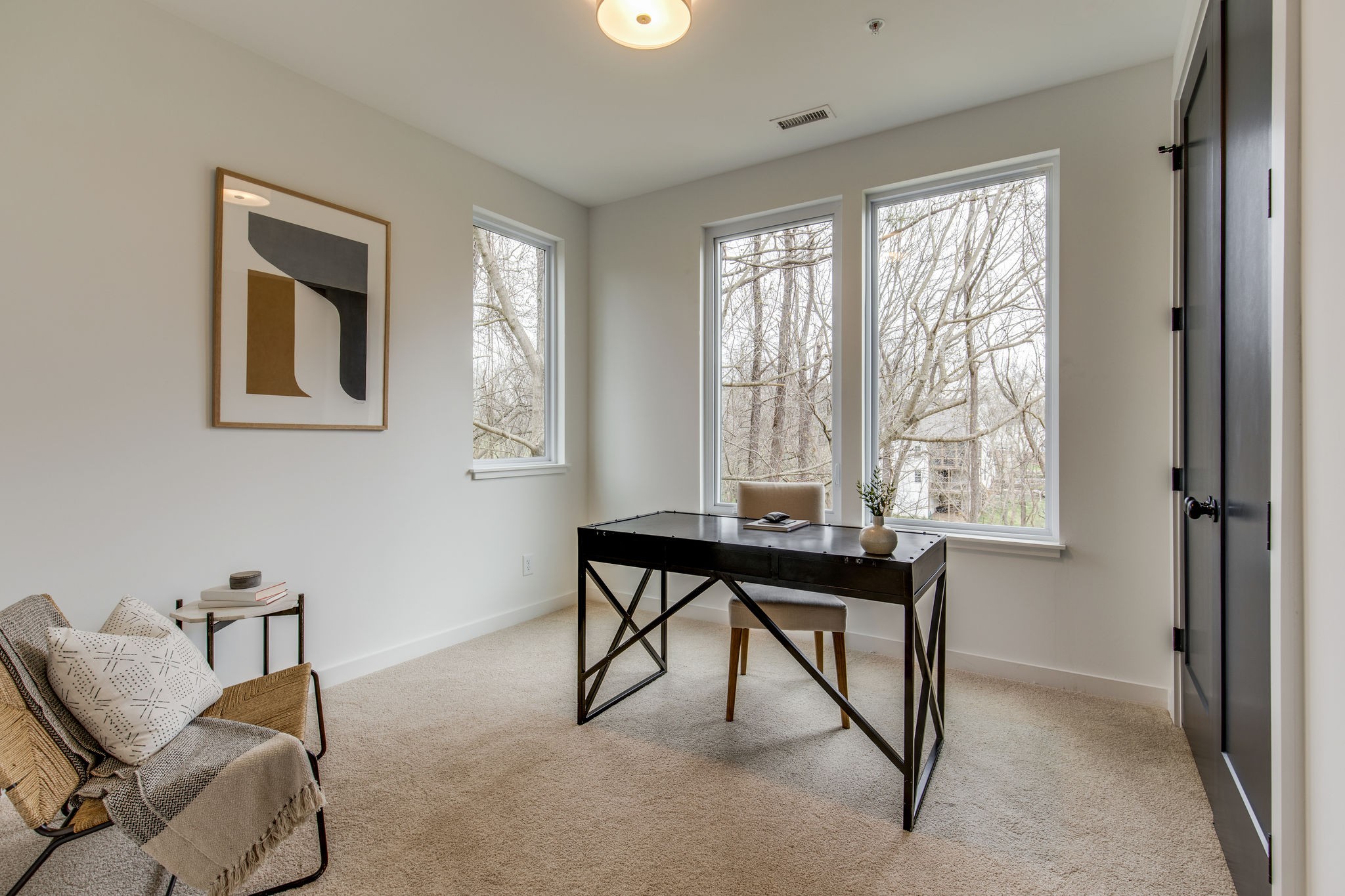 1005 B Mitchell Road Nashville, TN 37206 - Photo 18 of 25 a view of a workspace with furniture and a window