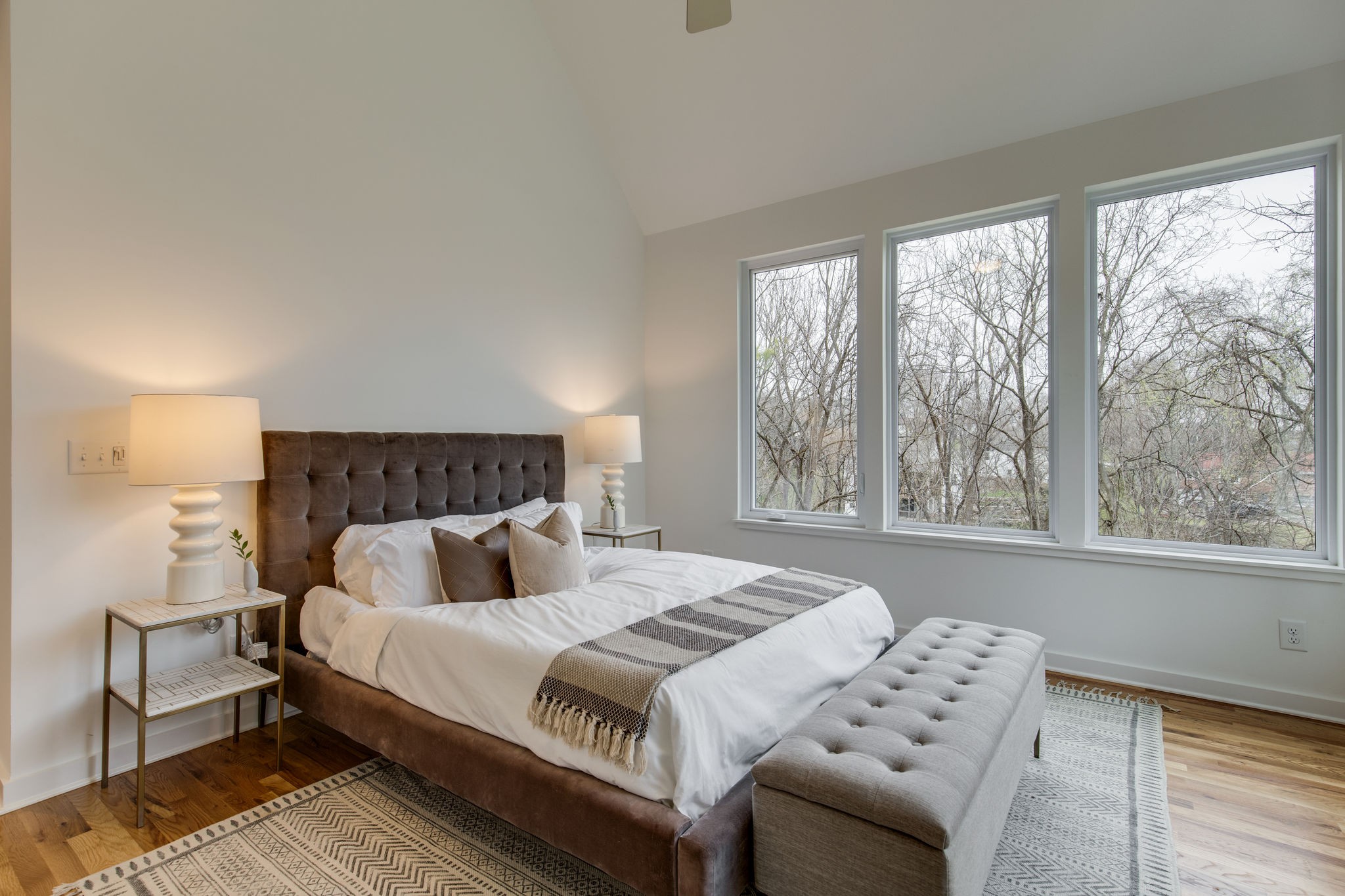 1005 B Mitchell Road Nashville, TN 37206 - Photo 9 of 25 a bedroom with a bed and wooden floor