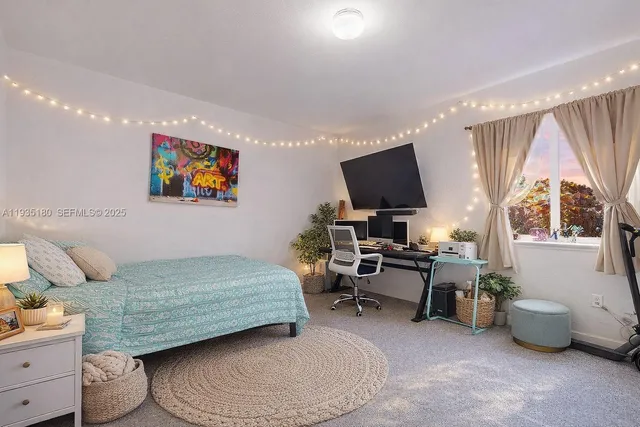 a bedroom with a bed and a couch