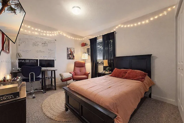 a view of a hallway with closet and wooden floor