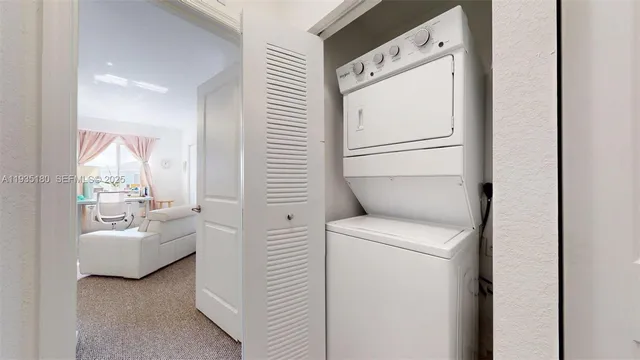 a view of a chairs and table in the backyard