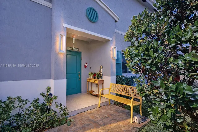 a bench sitting in backside of a house