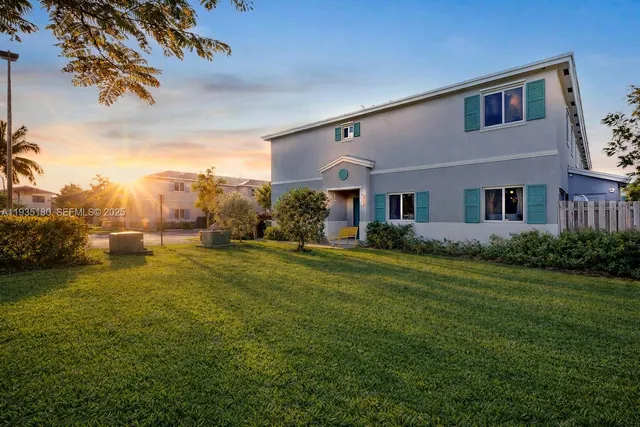 a view of a garden with a house