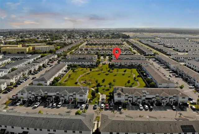 a bedroom with furniture and a chandelier