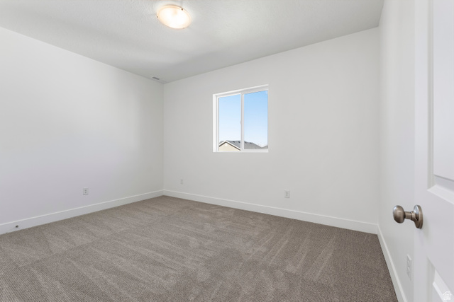 58 South Crimson Way, Unit 306 Mapleton, UT 84664 - Photo 17 of 24 Neutral-toned carpeting complements crisp white walls