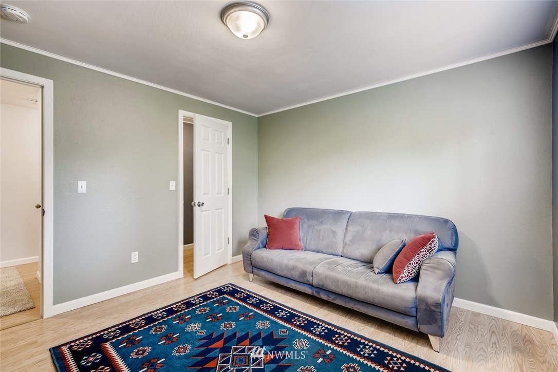 21604 9th Avenue West Bothell, WA 98021 - Photo 22 of 38 a living room with furniture and a rug