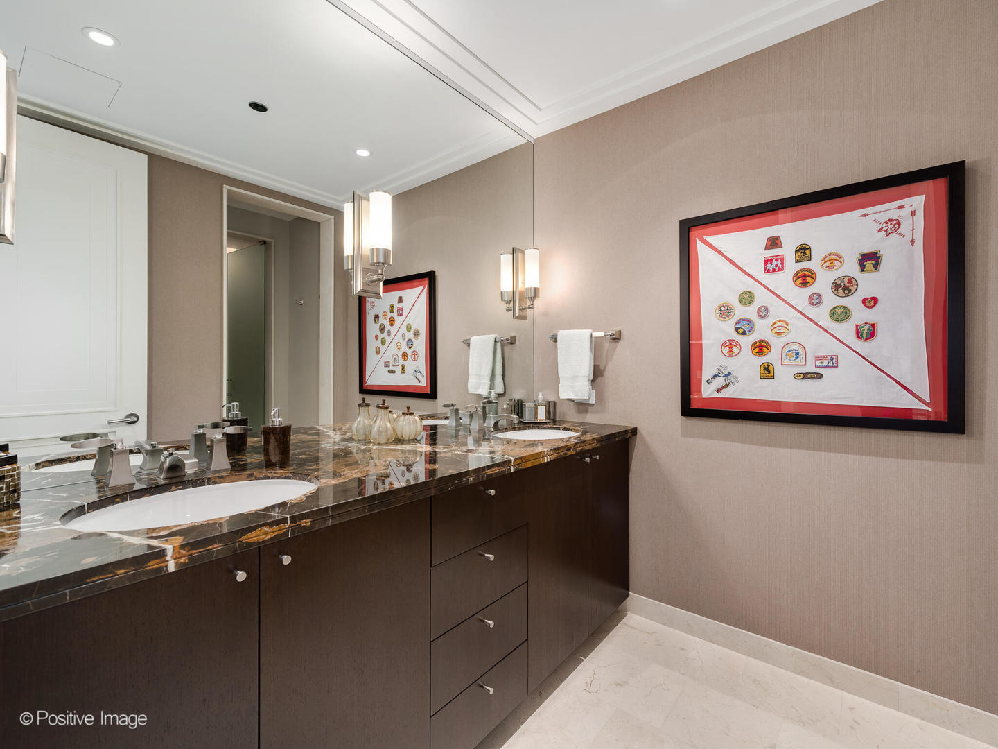 159 East Walton Place, Unit 18A Chicago, IL 60611 - Photo 48 of 54 a bathroom with double vanity sink and a mirror