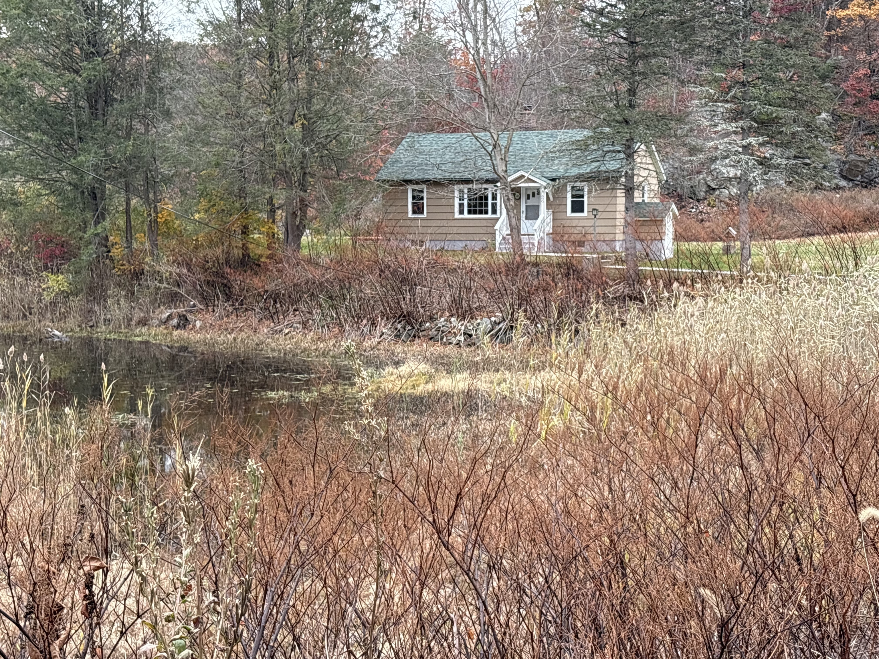 690 Greystone Road Plymouth, CT 06782 - Photo 2 of 16 a front view of a house with a yard