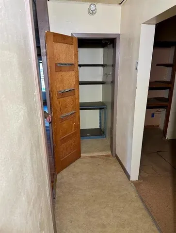 a view of an empty walk in closet