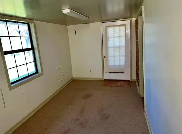 an empty room with windows