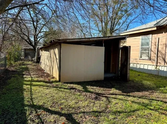 a view of a backyard of the house