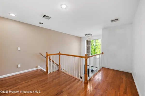 a view of entryway with wooden floor