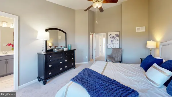 a bedroom with a bed and a couch