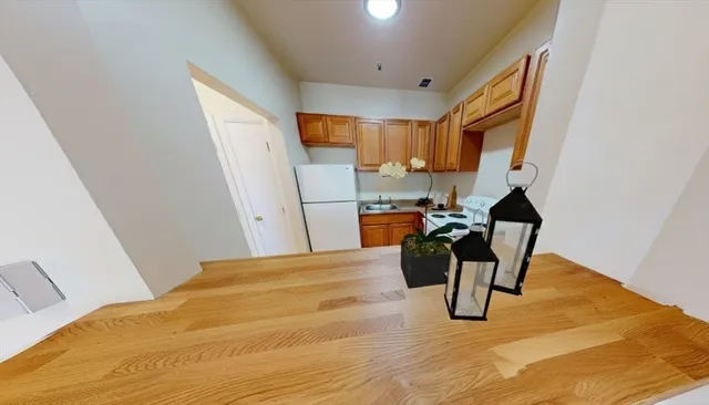 a bed room with a bed and a chair