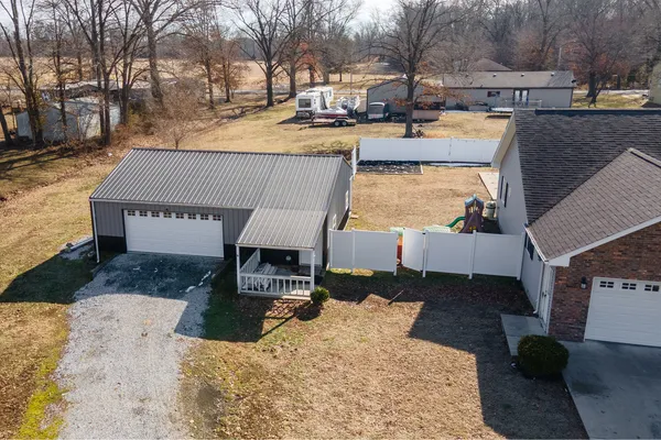 an aerial view of a house with swimming pool