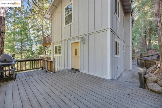 a view of a house with wooden deck