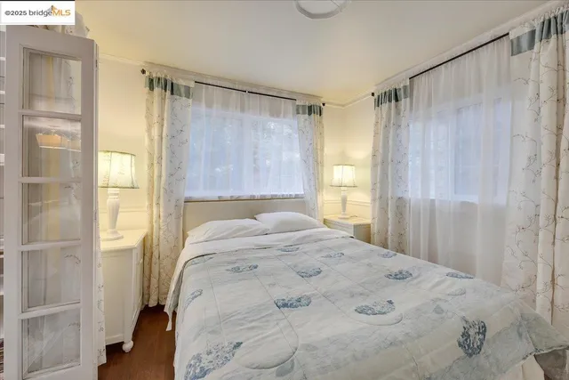 a bedroom with bed and a fireplace