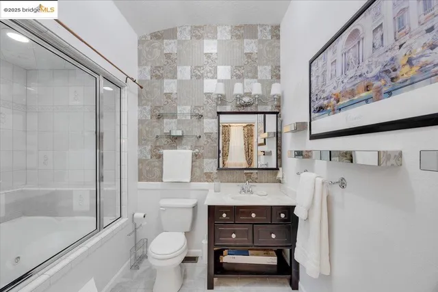 a bathroom with a sink double vanity and a bathtub
