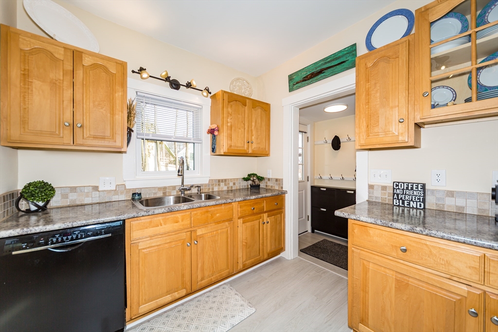 62 Central Street Framingham, MA 01701 - Photo 14 of 35 a kitchen with stainless steel appliances granite countertop a sink stove and cabinets
