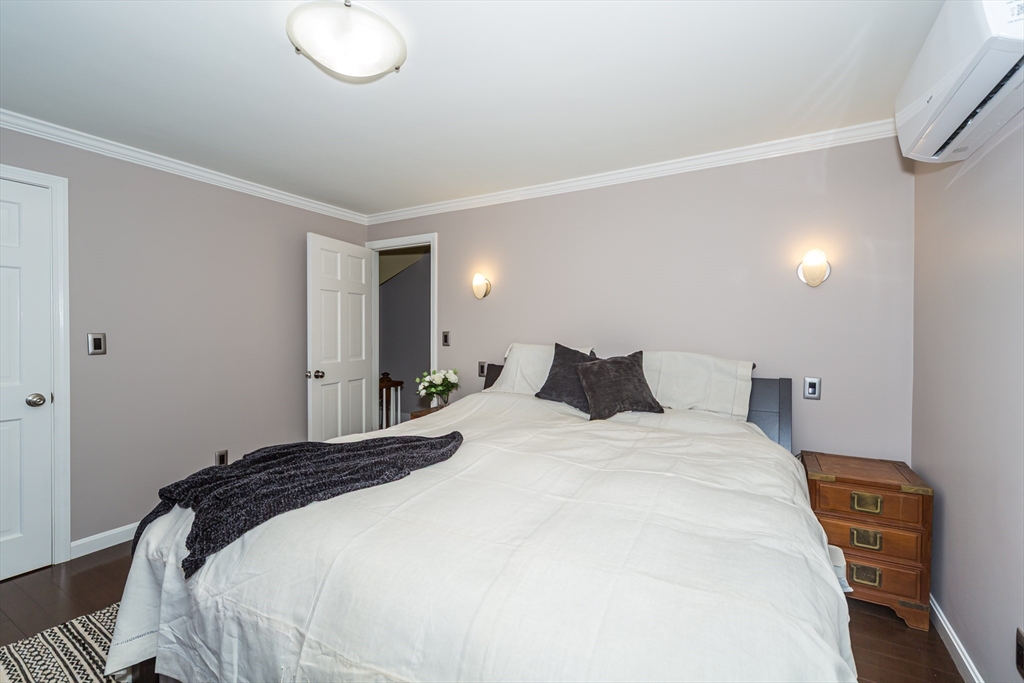 62 Central Street Framingham, MA 01701 - Photo 17 of 35 a bedroom with a bed and a lamp