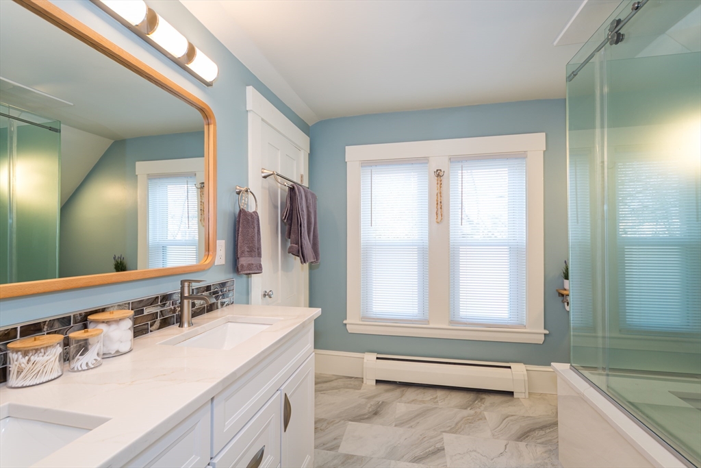 62 Central Street Framingham, MA 01701 - Photo 20 of 35 a spacious bathroom with a tub sink and mirror