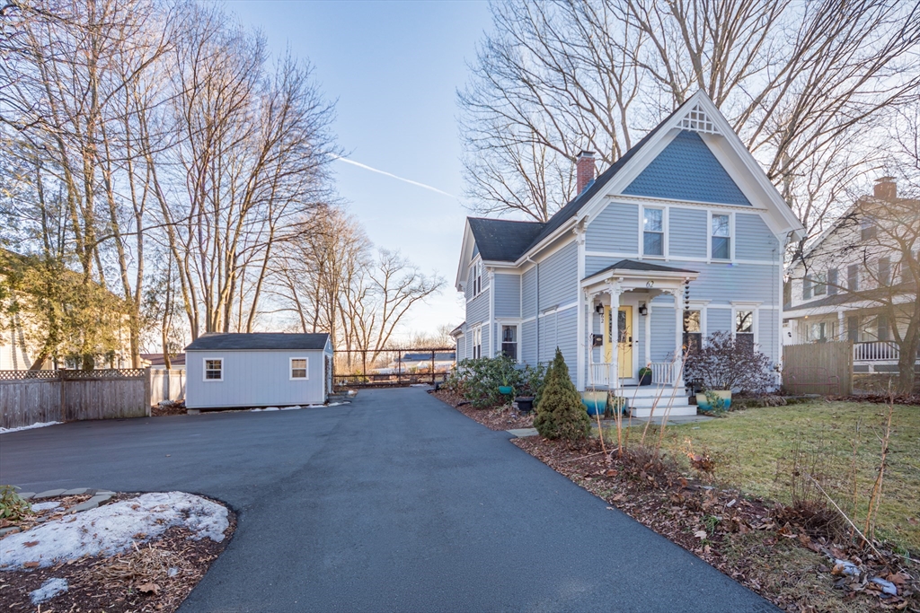 62 Central Street Framingham, MA 01701 - Photo 26 of 35 a front view of a house with a yard and garage