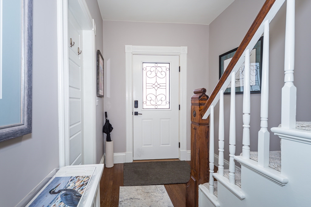 62 Central Street Framingham, MA 01701 - Photo 3 of 35 a view of an entryway with wooden floor and a livingroom