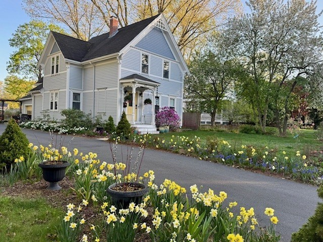 62 Central Street Framingham, MA 01701 - Photo 32 of 35 a front view of a house with a yard and a garden