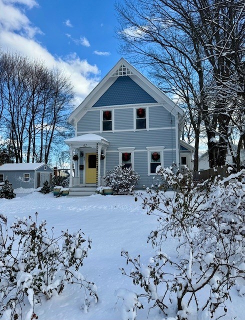 62 Central Street Framingham, MA 01701 - Photo 33 of 35 a front view of a house with a yard covered with snow