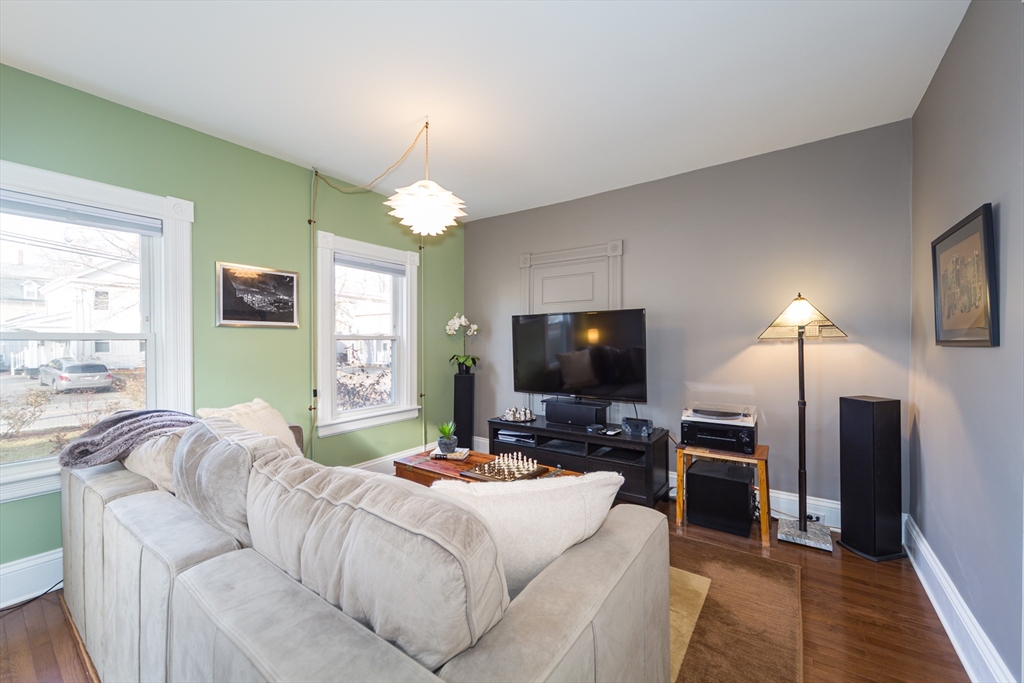 62 Central Street Framingham, MA 01701 - Photo 6 of 35 a living room with fireplace furniture and a flat screen tv