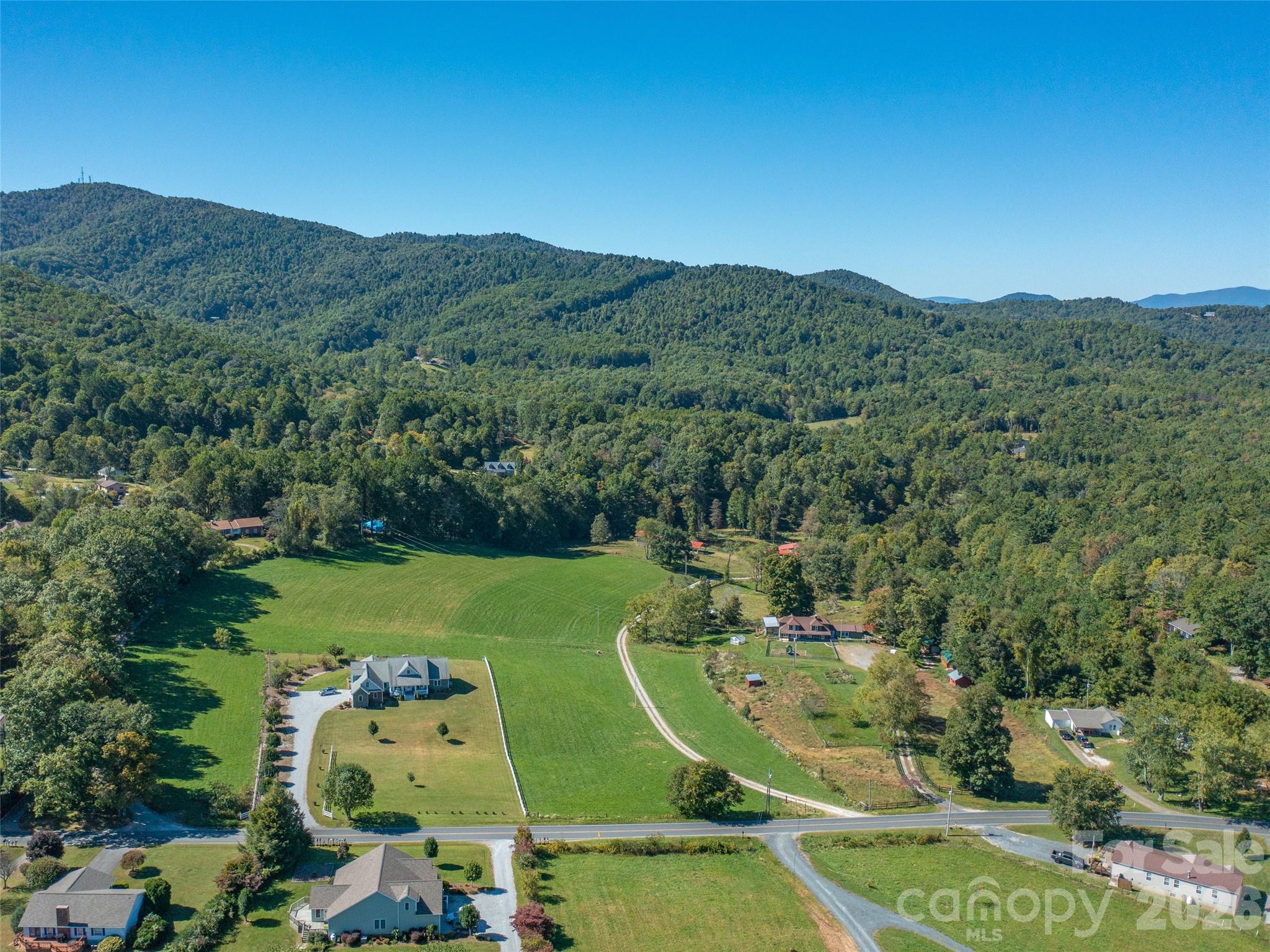 1050 Dale Road Spruce Pine, NC 28777 - Photo 2 of 46 an aerial view of a house with a garden