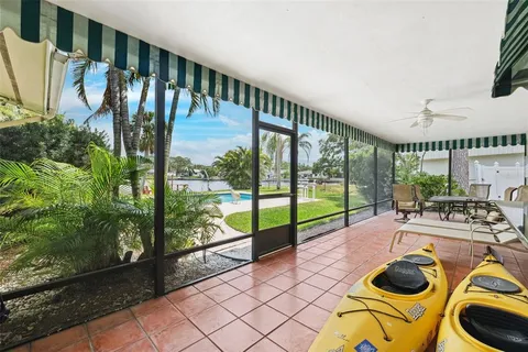 a room with musical instrument pool table and windows