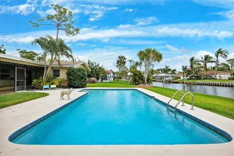 a view of a swimming pool with an outdoor seating