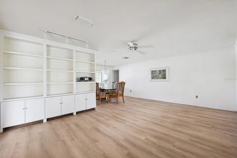 a view of a room with cabinet and wooden floor