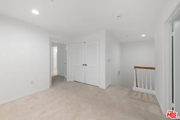 a view of empty room with windows