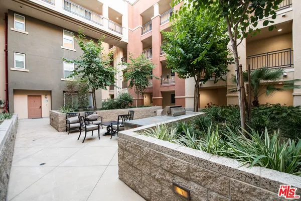 a view of a patio with furniture