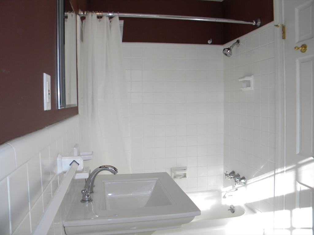 21 Lovers Lane Groton, MA 01450 - Photo 15 of 35 a bathroom with a sink and a mirror