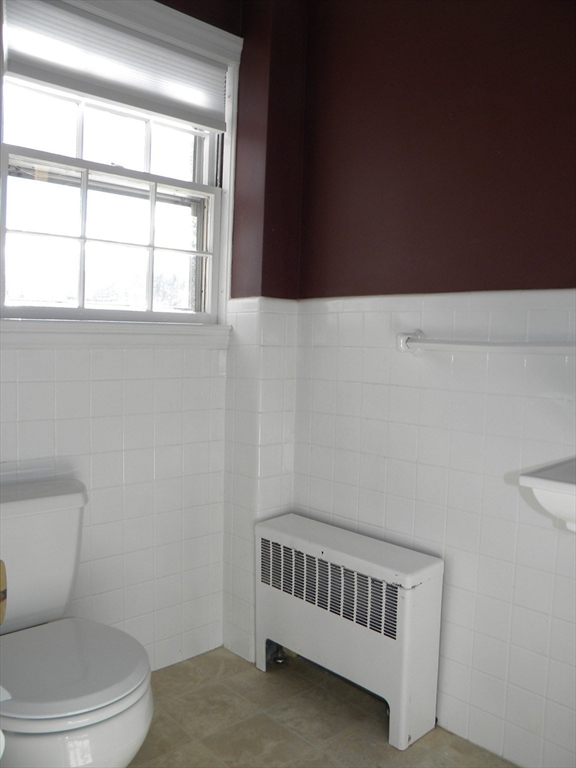 21 Lovers Lane Groton, MA 01450 - Photo 16 of 35 a bathroom with a toilet a sink and mirror